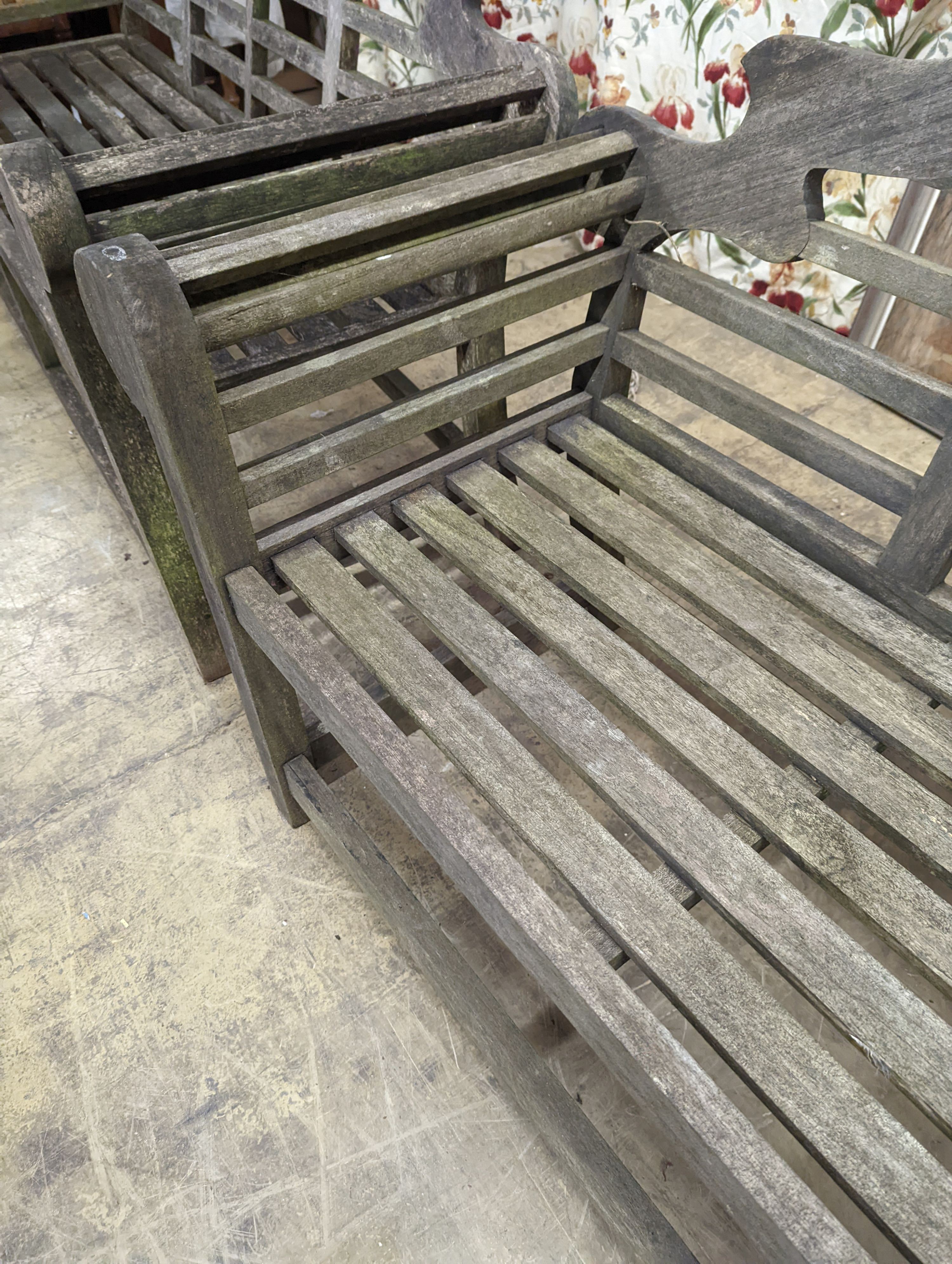 A pair of Lutyens style weathered teak garden benches, length 166cm, depth 53cm, height 105cm